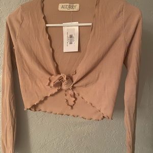 Beige long sleeve tie top, size small, never worn/perfect condition